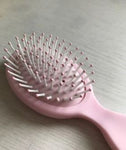 SHEIN 1pc Oval Mini Portable Hair Brush Plastic Detangler, ,For Women Men